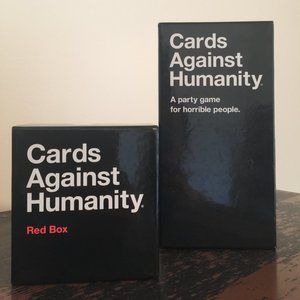 Two boxes of Cards Against Humanity